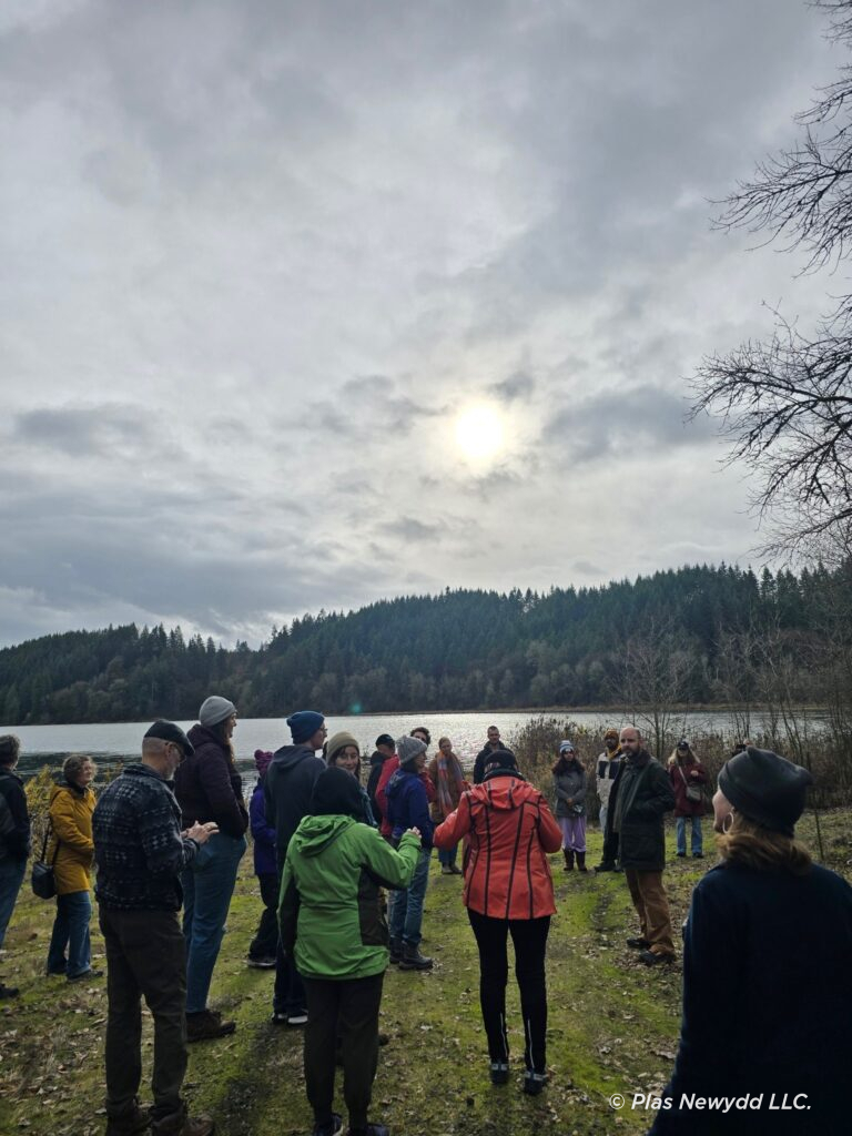 Picture of people standing together looking at Plas Newydd Farm